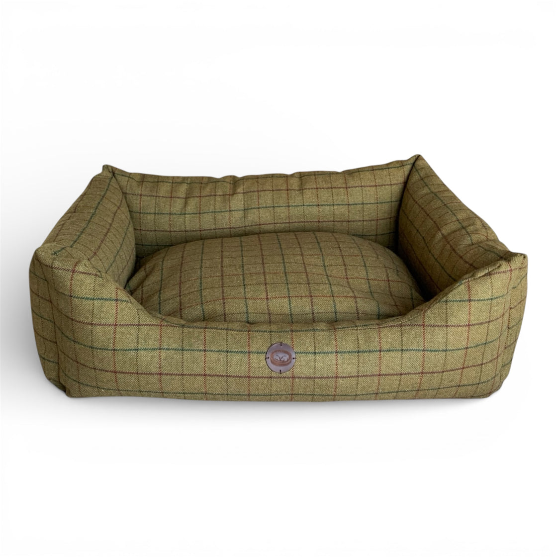 Green checkered pet bed on a white background